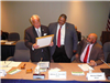 HRTAC Chair William D. Sessoms Jr. Presenting a Resolution of Appreciation to HRTAC Member Kenneth W