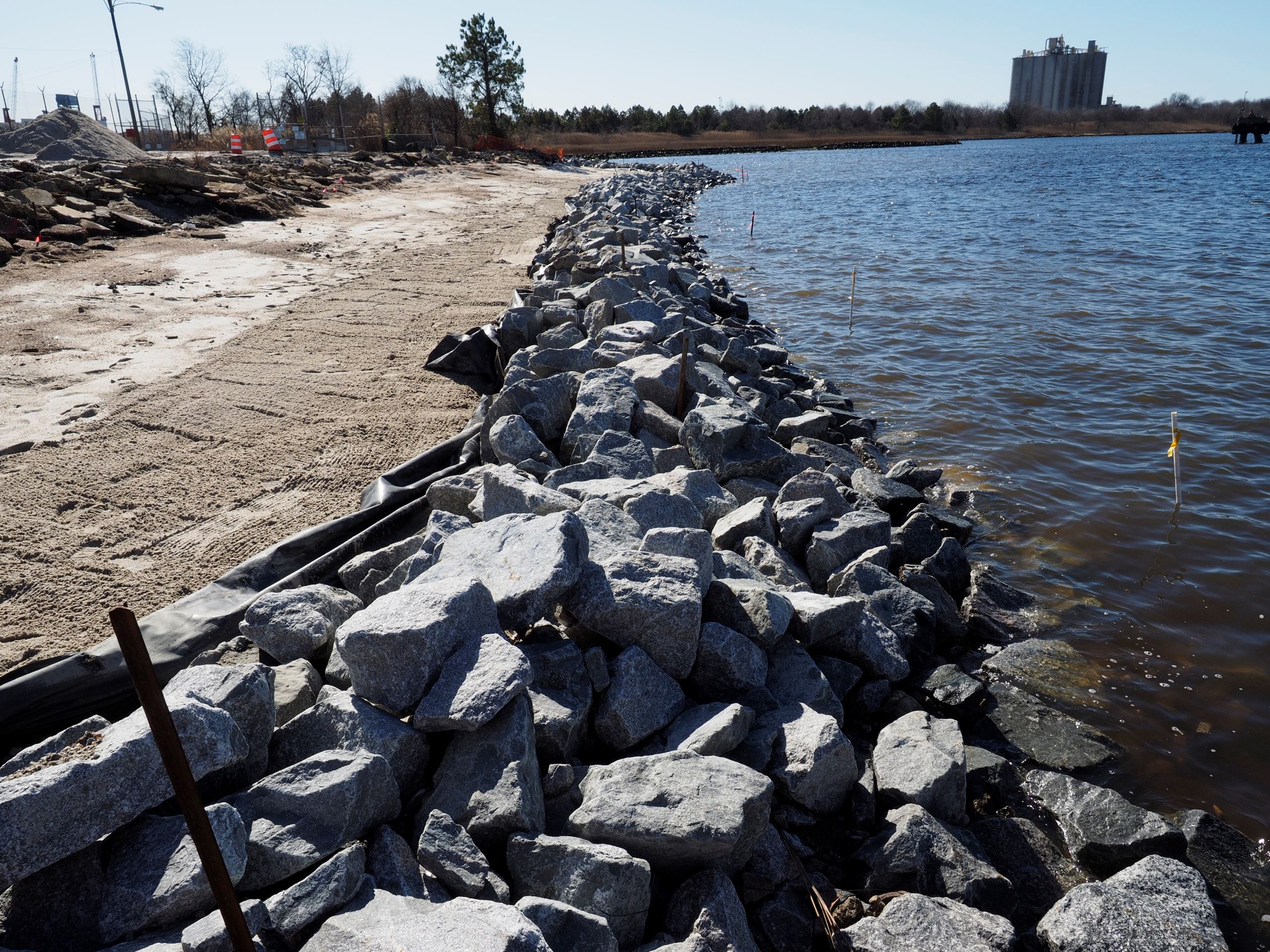 The shoreline was barren (left), a rock sill and sand were added for protection (middle), and plants
